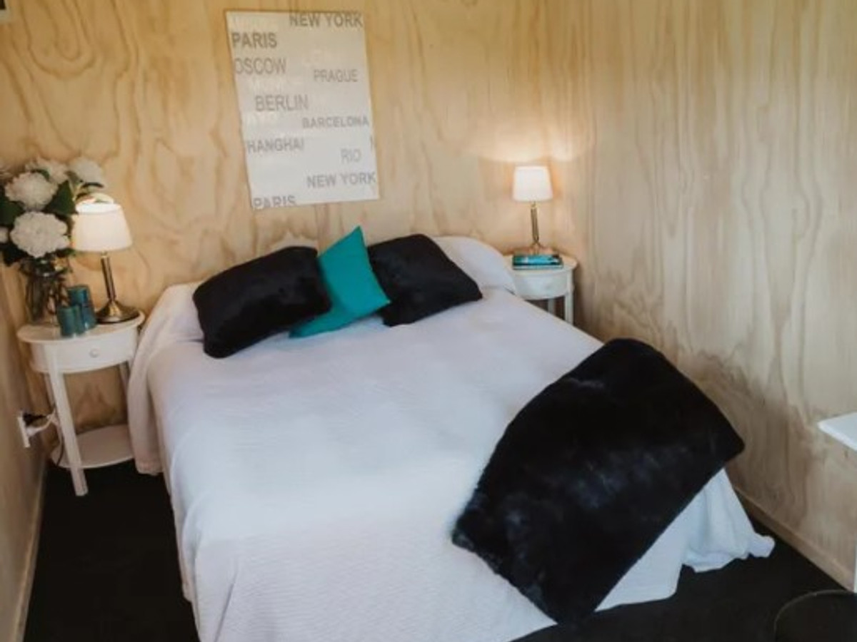 Large+ cabin bedroom with queen bed and teal accents